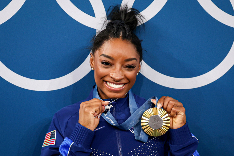 Simone Biles says she knew people would 'go crazy over' her 'GOAT' necklace