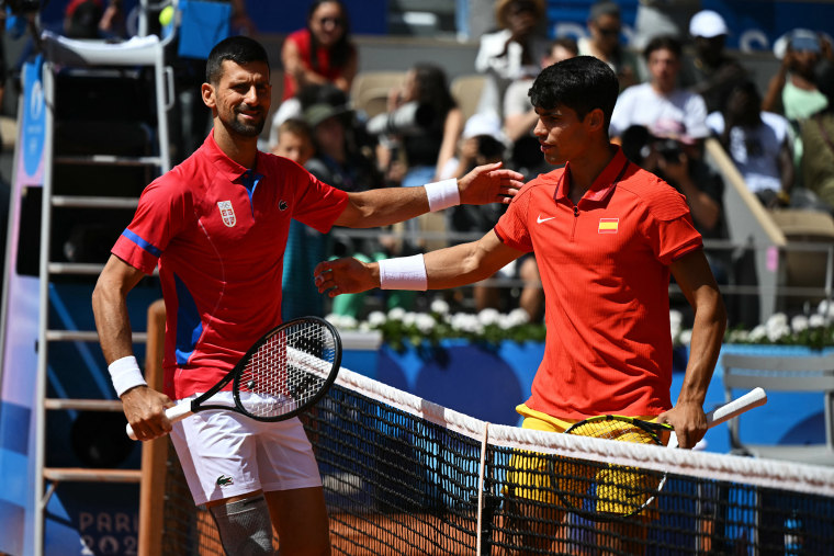 Novak Djokovic and Carlos Alcaraz ahead of the men's singles final tennis match during the Paris 2024 Olympic Games, in Paris on August 4, 2024. 