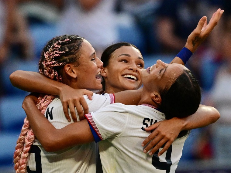 U.S. teammates, from left, Trinity Rodman, Sophia Smith and Mallory Swanson celebrate after Smith scored in the 95th minute against Germany.