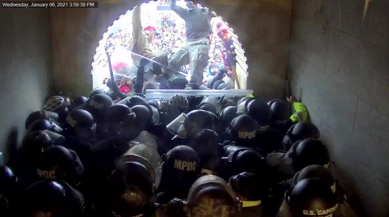 David Dempsey, atop a crowd of Capitol rioters, stomps on officers