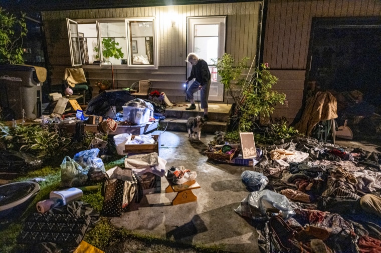 Belongings drying in front of a home.