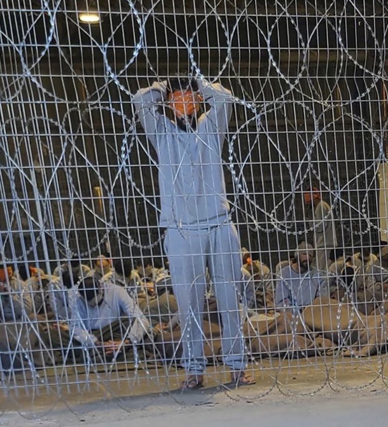 A photo from 2023 provided by the Israeli organization Breaking The Silence shows blindfolded Palestinian prisoners captured in the Gaza Strip at a detention facility on the Sde Teiman military base in southern Israel.