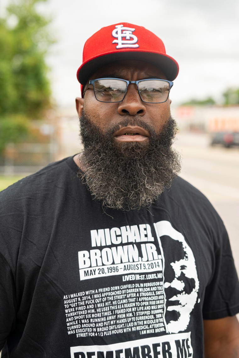 Michael Brown Sr. poses for a portrait outdoors, looking into the camera