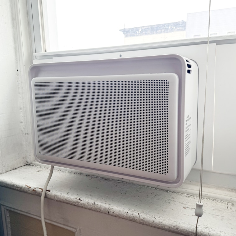 Windmill window air conditioner installed in a window in an apartment