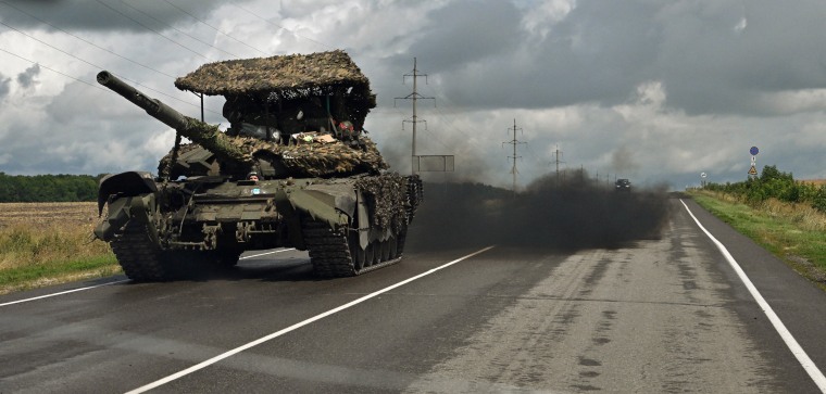 A Russian battle tank T-72 drives outside the town of Sudzha, Russia