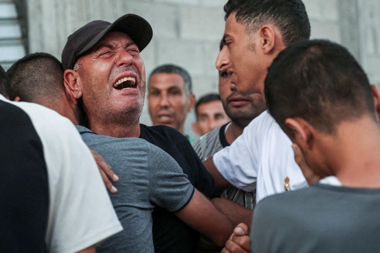 A man mourns a relative.