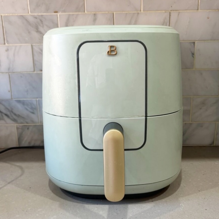 Beautiful by Drew air fryer sitting on a kitchen counter.