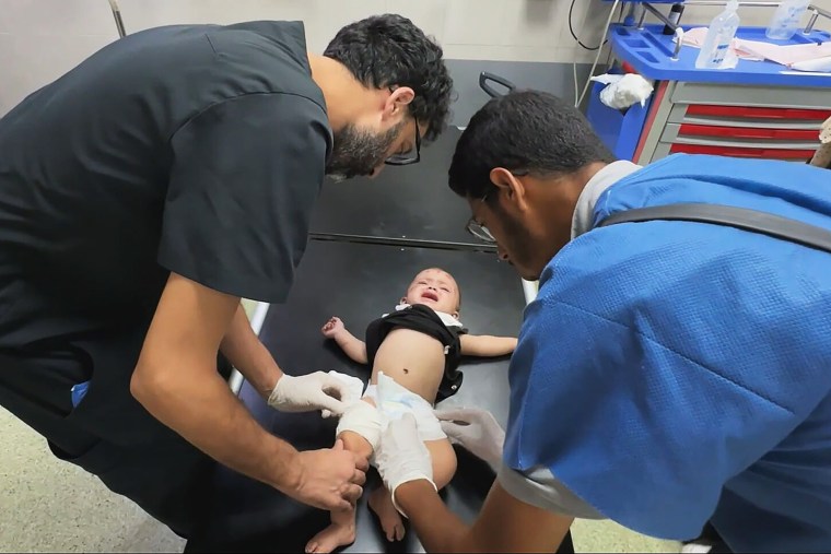 Reem Jehad Abou Haya is examined by doctors in Gaza.