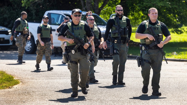 Officers with the North Carolina Prison Emergency Response Team search for escaped inmate Ramone Alston