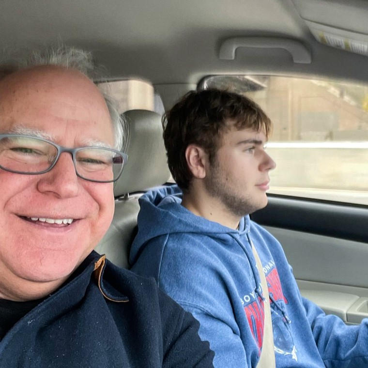 A selfie of Tim Walz and his son, Gus, inside of a car as Gus drives