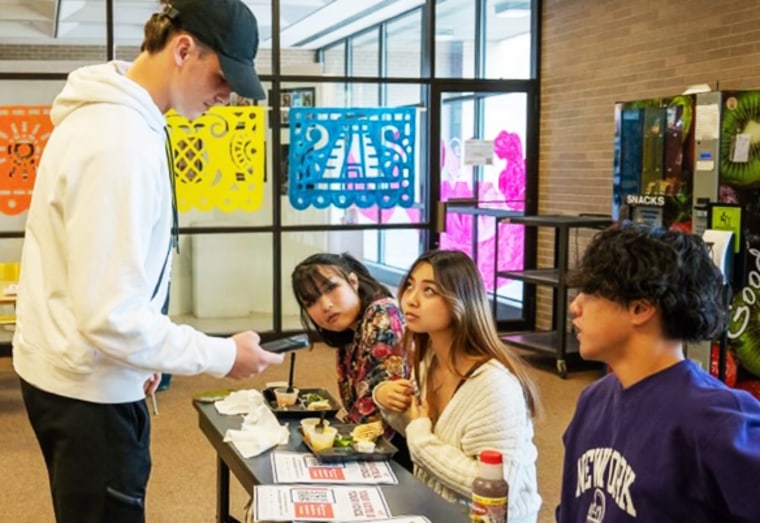 Collin Wang, right, hosted five voter registration drives at his high school in Pennsylvania. 