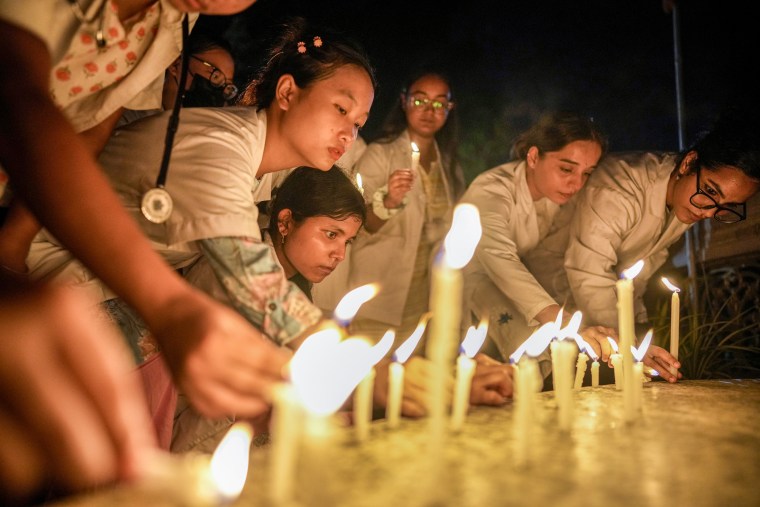 Students light up candles.