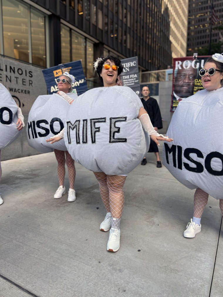 Protesters dress up as mifepristone and misoprostol tablets at a reproductive rights rally in Chicago.