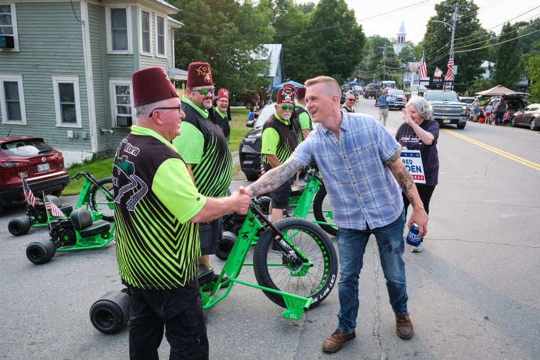 Jared Golden shakes hands with people outside