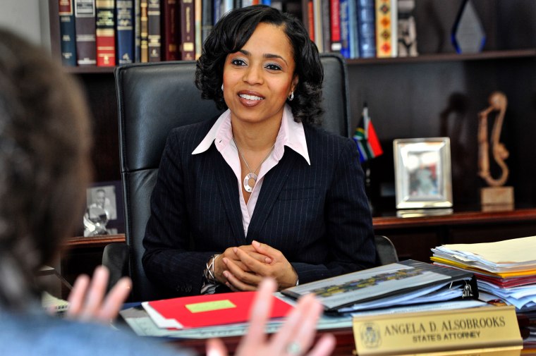 Angela Alsobrooks sits behind her desk in her office