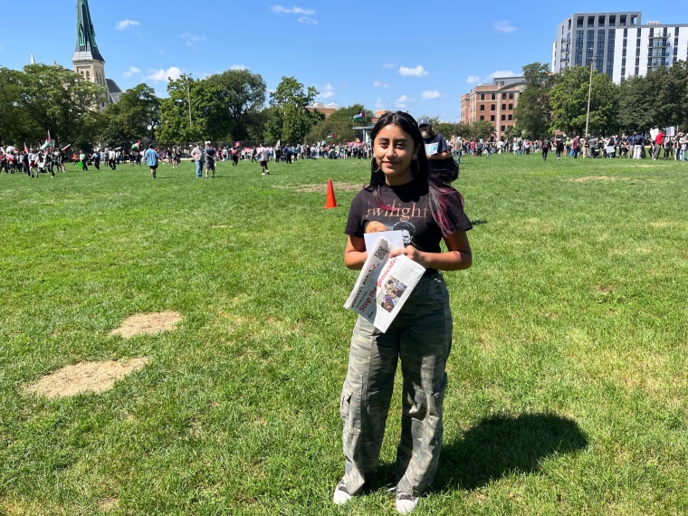 Mariana Espana stands outside on a lawn