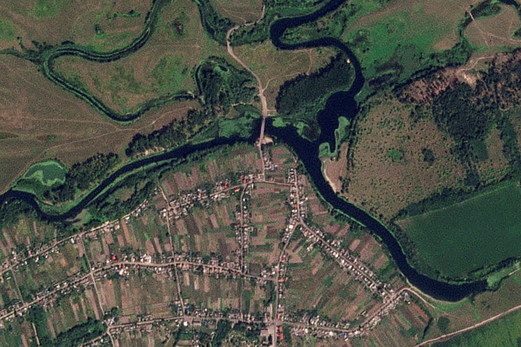 A satellite image shows a strategic bridge over the Seym River that has been destroyed, in Zvannoe