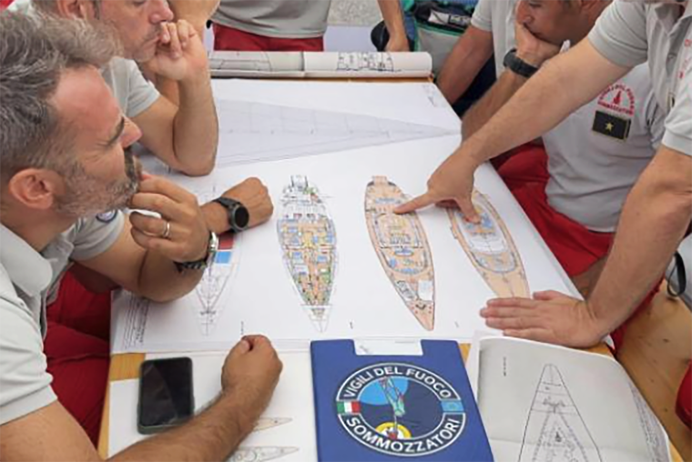 Italian rescue review blueprints of sunken yacht in photos released on Aug 19. 2024.