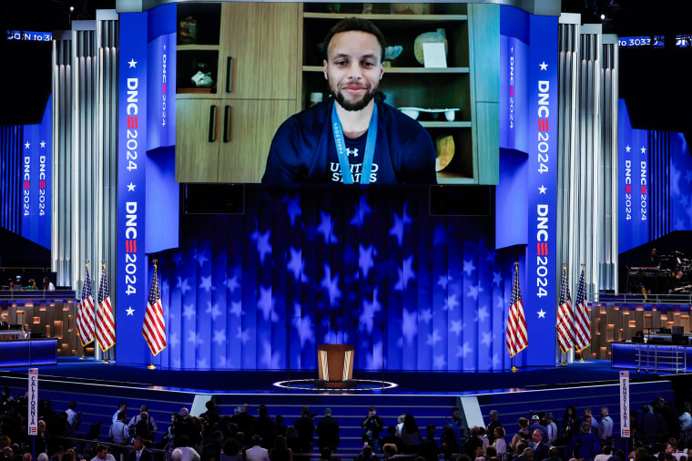 Steph Curry on a screen smiling