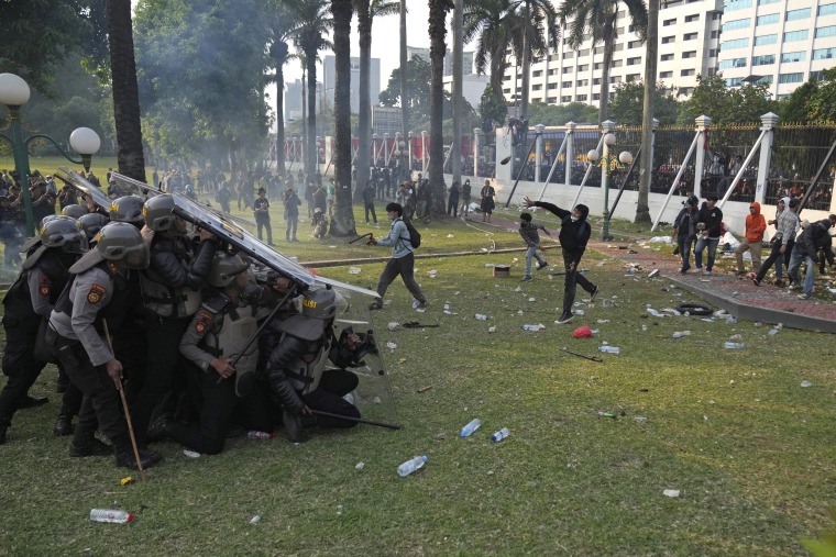 Protesters clash with police during a protest in Jakarta