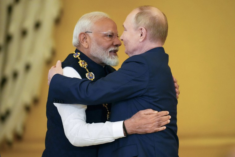 Modi hugs Putin in Moscow