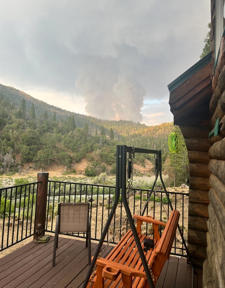 Smoke from the 2023 Head Fire is seen from Becky Wade and Jeff McCabe's deck. 