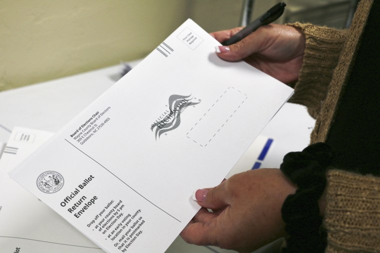 Preparing absentee ballots at the Wayne County Board of Elections office in 2022 in Goldsboro, N.C.