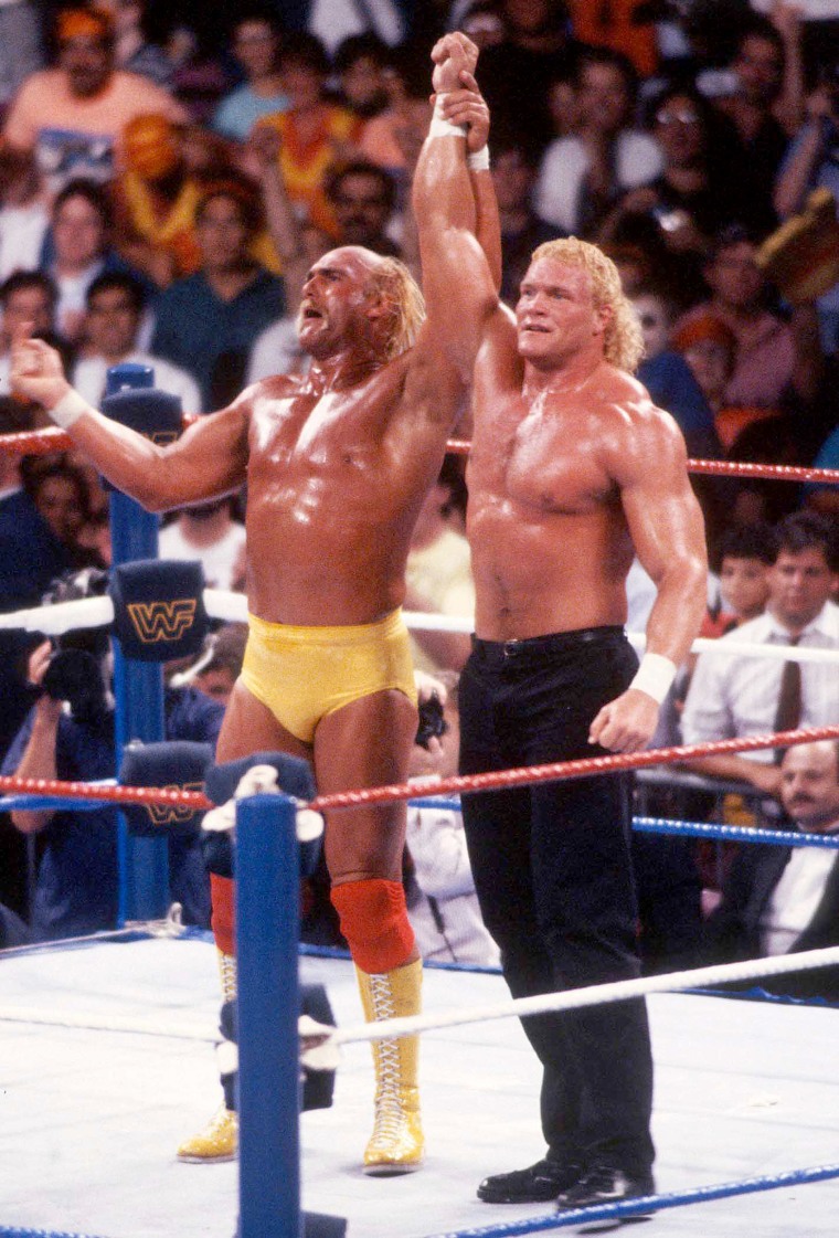 Sid Eudy and Hulk Hogan with hands raised