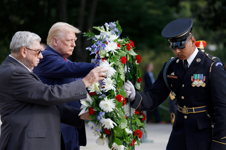 Donald Trump stands next to Bill Barnett