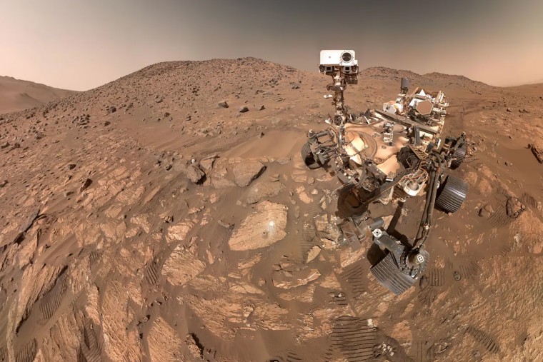 NASA’s Perseverance Mars rover took this selfie, made up of 62 individual images, on July 23. A rock nicknamed “Cheyava Falls,” which has features that may bear on the question of whether the Red Planet was long ago home to microscopic life, is to the left of the rover near the center of the image.