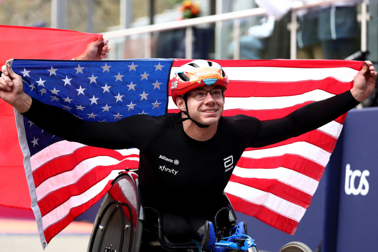 Daniel Romanchuk holds a US flag