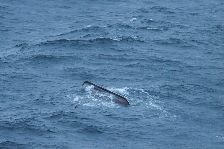 A ship is seen fallen sideways and drowned in the ocean