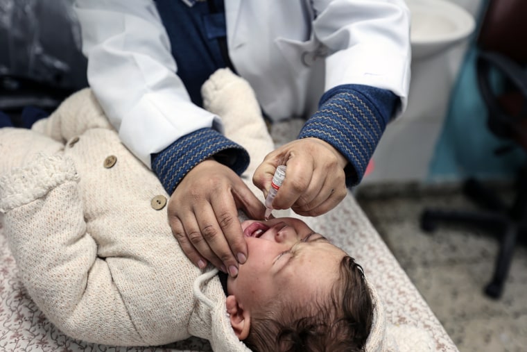 A doctor delivers polio and rotavirus vaccination