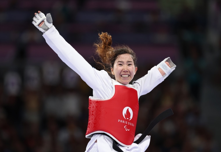 Zakia Khudadadi of the Refugee Paralympic Team celebrates after winning the women's taekwondo K44 -47kg repechage contest against Nurcihan Ekinci of Turkey.