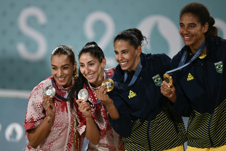 Canadians Melissa Humana-Paredes and Brandie Wilkerson, gold medalists Brazilians Ana Patricia Silva Ramos and Eduarda Santos Lisboa