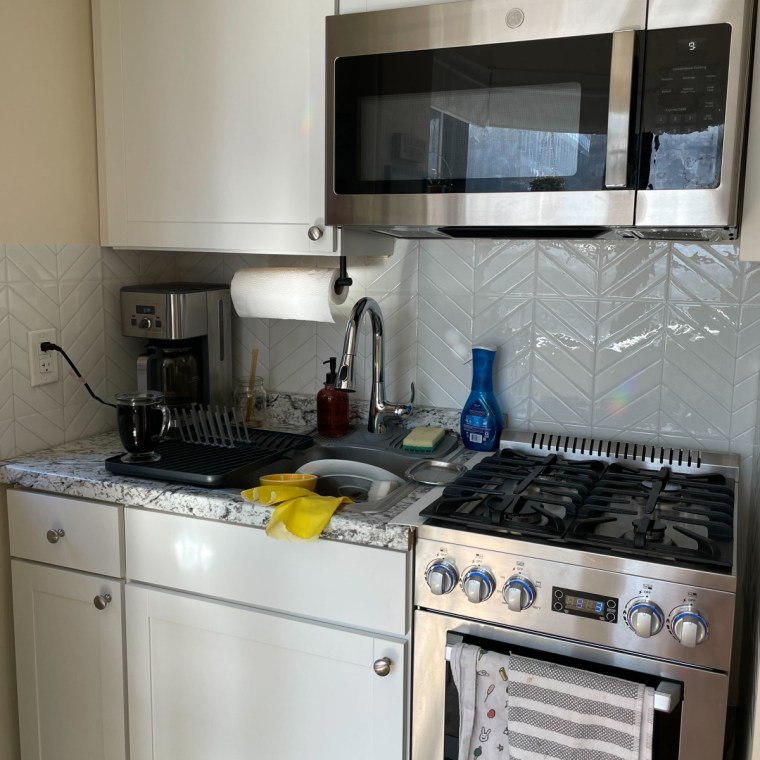 kitchen backsplash with white chevron peel and stick tiles. 