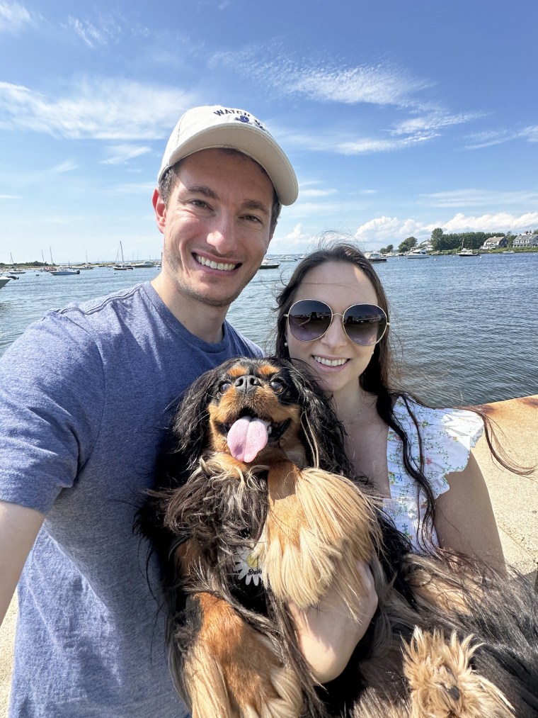 The to-be-weds pose with their pup, Daisy.