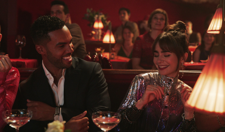 Lucien Laviscount as Alfie and Lily Collins as Emily in "Emily in Paris."