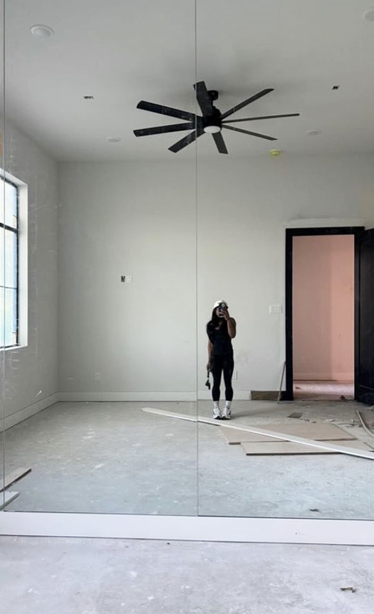 In another snap, Biles took a selfie in a second room under construction.