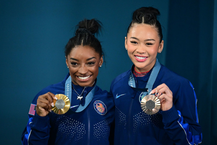 Simone Biles and Sunisa Lee from the USA celebrate gold and bronze. 