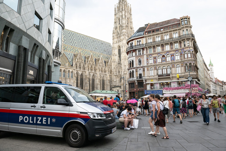 Police guards Stephansplatz as Taylor Swift fans gather to sing together in Vienna, Austria.