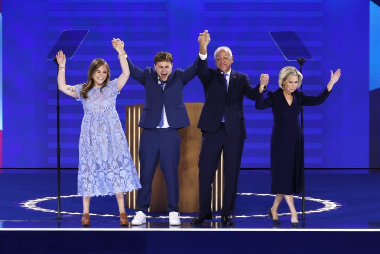 Tim Waltz celebrates with his daughter Hope Waltz (left), son Gus Waltz (second from left), and wife Gwen Waltz (right) after accepting the Democratic vice presidential nomination.