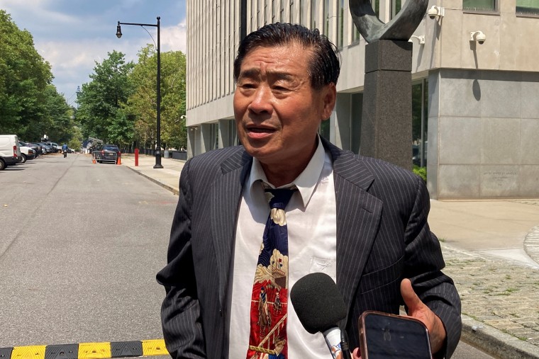 Chinese-American scholar Wang Shujun speaks to reporters after being sentenced in a Brooklyn federal court on charges of acting as an illegal agent of the Chinese government, in New York