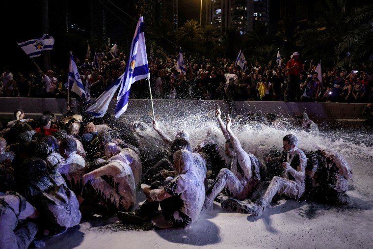 Police use water cannon during a rally to show support for the hostages who were kidnapped during the deadly October 7 attack in Tel Aviv