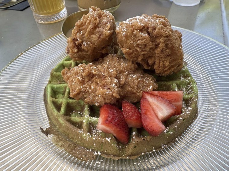 An order of "Resting Brunch Face," fried chicken on a pandan waffle with Vietnamese iced coffee syrup, is served at Breaking Dawn restaurant in Los Gatos, Calif., on Sunday, Aug. 4, 2024.