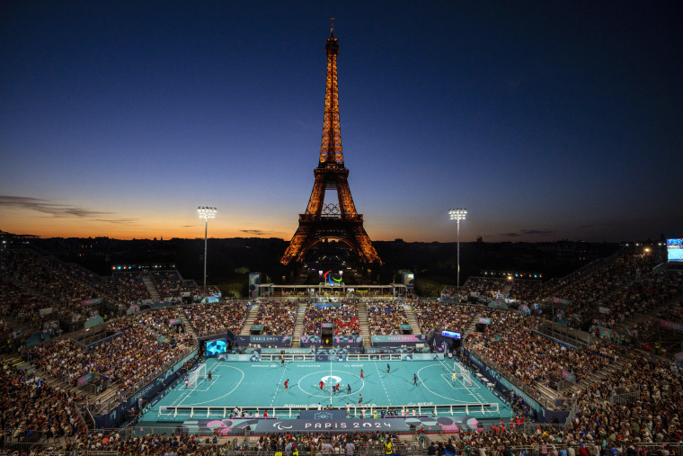 Blind soccer players from France and China at the Eiffel Tower Stadium.