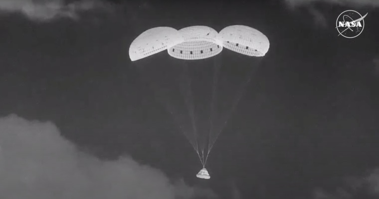 The Boeing Starliner capsule floats down to New Mexico.