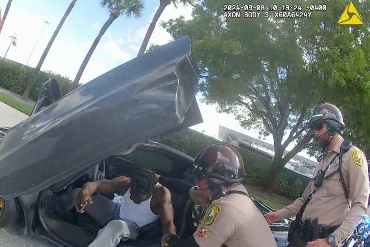 nfl football player arrest vehicle car extraction by force forcibly