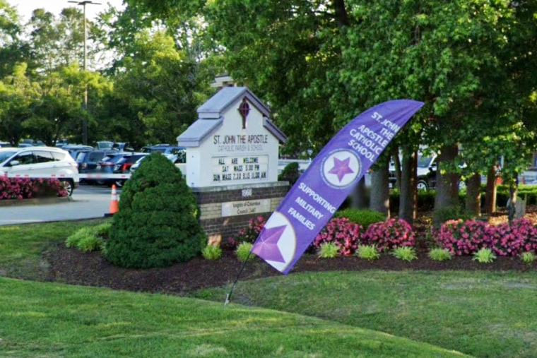 A street scene of the exterior of St. John the Apostle Catholic School.