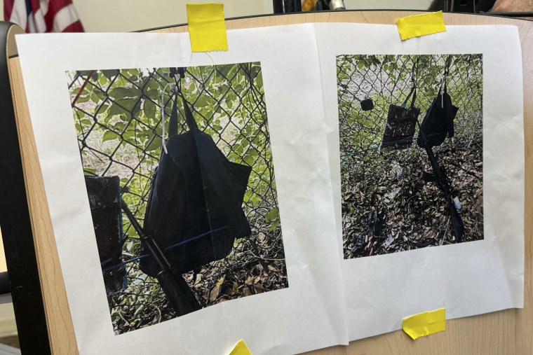 Photos that show a rifle, a backpack and a GoPro camera on a fence outside Trump International Golf Club taken after an apparent attempt to assassinate Donald Trump are displayed during a news conference at the Palm Beach County, Fla., Main Library on Sunday. 